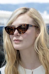 Cannes Film Festival: dark glasses, red carpet Elle Fanning wearing Saint Laurent Glasses