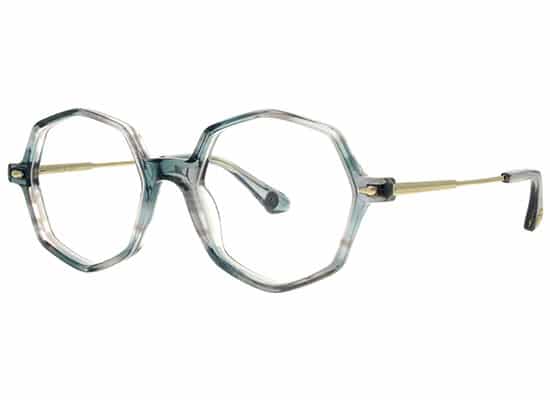 Oversized octagonal eyeglasses with blue transparent frames and contrasting gold metal temples for a modern look. paul & joe brand