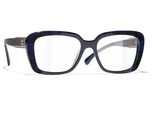Wide frame eyeglasses in navy blue acetate with stripes and gold hinges with the Chanel brand logo