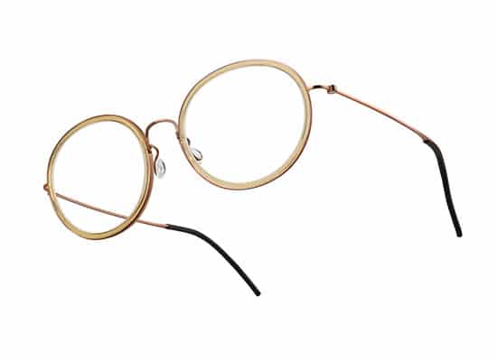 Classic round gold frame glasses with a minimalist design and black temple tips.