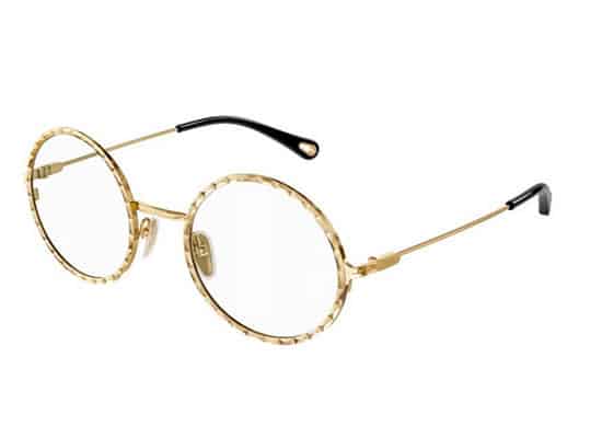 Stylish round glasses with a unique gold frame and pattern detail, reminiscent of classic vintage style. chloe brand