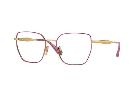 Geometric eyeglasses with gold metal frame and pink details on the corners and temples. vogue brand
