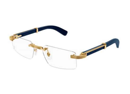 Half-rimmed eyeglasses with navy blue top frame, gold metal temples and blue details. cartier brand