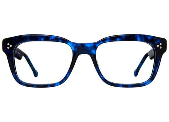 Rectangular eyeglasses with blue tortoiseshell acetate frame and decorative studs at the upper corners.