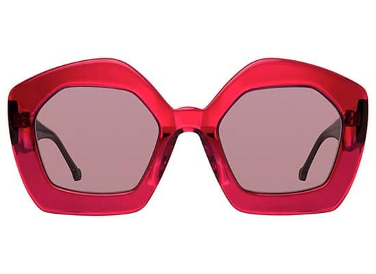 Square sunglasses with a thick transparent red frame and tinted lenses.