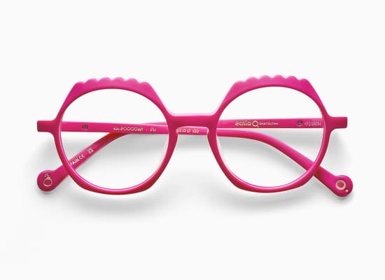 Pink children's glasses, playful style and wavy contours, with markings on the temples. Cartoon collection of etnia barcelona